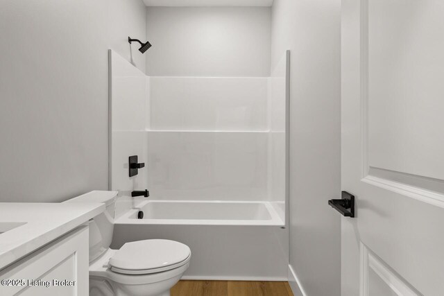 506 Capps Rd, Campbellsville, KY 42718 - full bathroom with toilet, wood finished floors, shower / bath combination, and vanity