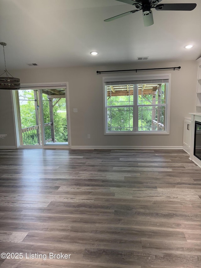 7997 Pikewood Field Way, Louisville, KY 40219 - unfurnished living room featuring plenty of natural light, recessed lighting, wood finished floors, baseboards, and a ceiling fan