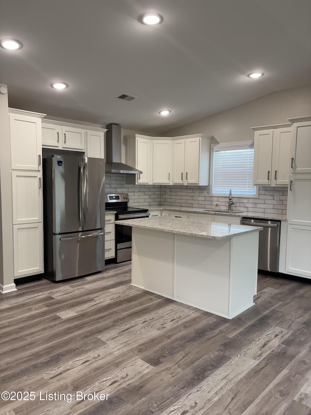 7997 Pikewood Field Way, Louisville, KY 40219 - kitchen featuring wall chimney exhaust hood, stainless steel appliances, a sink, a center island, and tasteful backsplash