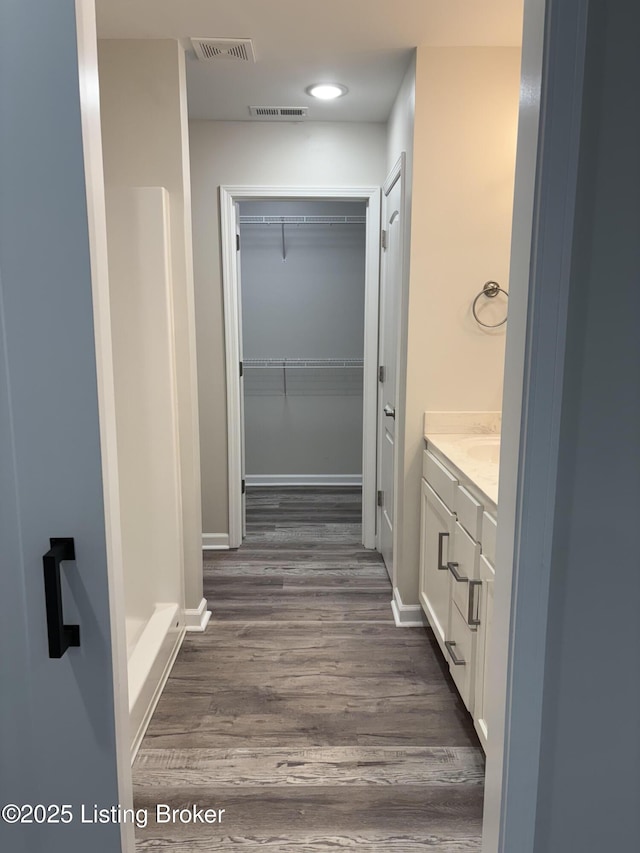 7997 Pikewood Field Way, Louisville, KY 40219 - bathroom featuring wood finished floors, vanity, baseboards, and recessed lighting