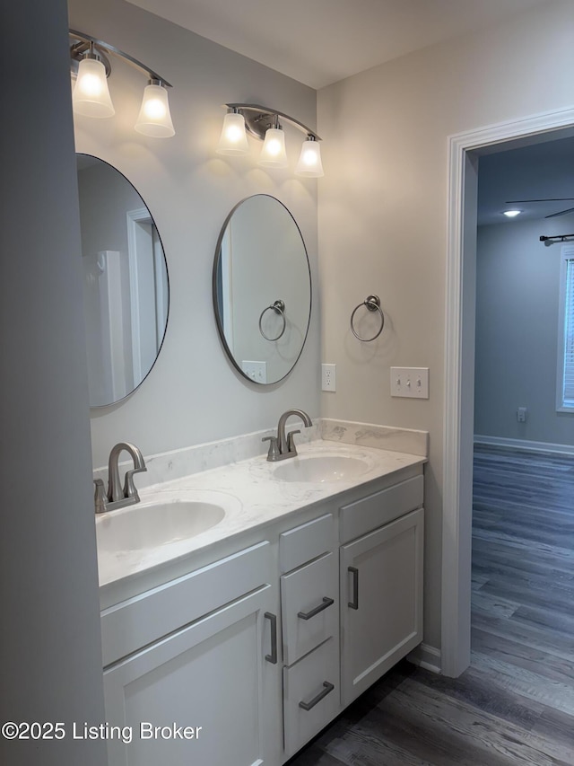 7997 Pikewood Field Way, Louisville, KY 40219 - bathroom featuring wood finished floors and double vanity