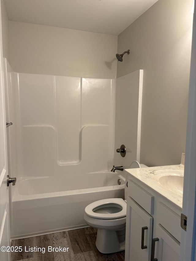 7997 Pikewood Field Way, Louisville, KY 40219 - full bath featuring toilet, bathing tub / shower combination, vanity, and wood finished floors
