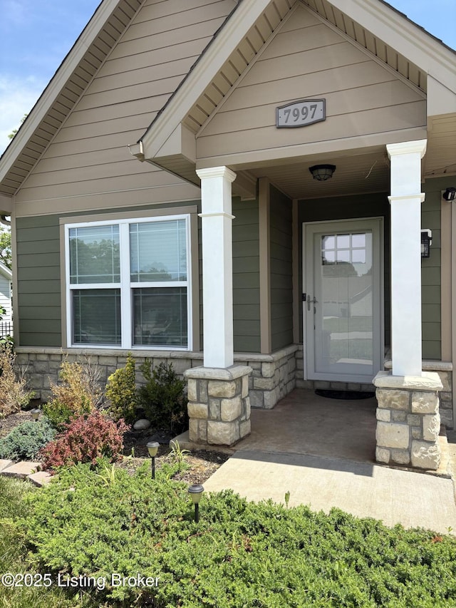 7997 Pikewood Field Way, Louisville, KY 40219 - view of exterior entry with stone siding and covered porch