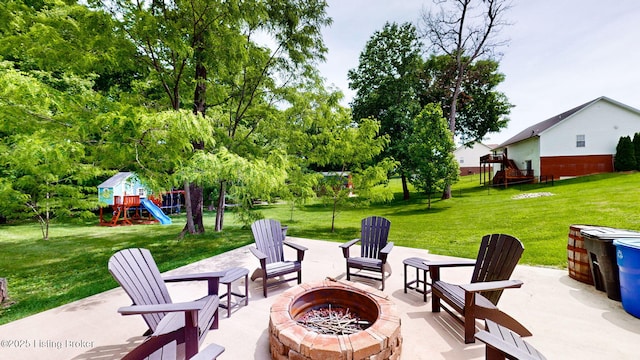 85 Summitt Dr, Brandenburg, KY 40108 - view of patio featuring an outdoor fire pit and a playground