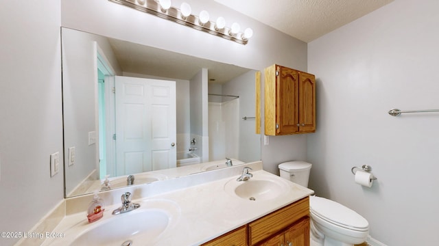 85 Summitt Dr, Brandenburg, KY 40108 - full bath with toilet, double vanity, a textured ceiling, and baseboards