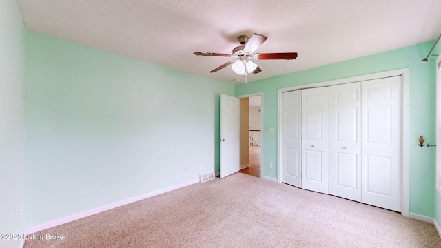 85 Summitt Dr, Brandenburg, KY 40108 - unfurnished bedroom featuring carpet flooring, a closet, baseboards, and ceiling fan
