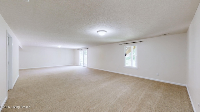 85 Summitt Dr, Brandenburg, KY 40108 - carpeted empty room featuring baseboards and a textured ceiling