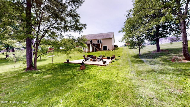 85 Summitt Dr, Brandenburg, KY 40108 - view of green lawn featuring a patio, stairway, and a deck