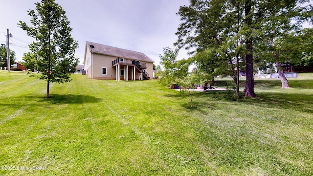 85 Summitt Dr, Brandenburg, KY 40108 - view of grassy yard featuring stairs and a deck