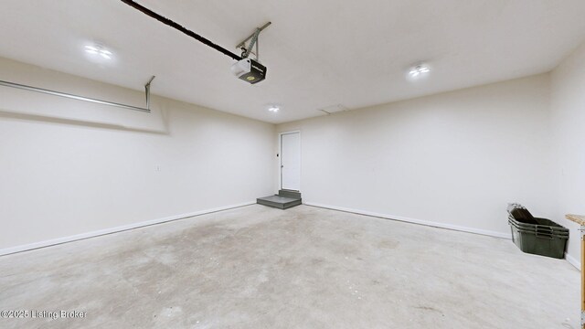 85 Summitt Dr, Brandenburg, KY 40108 - garage with a garage door opener and baseboards