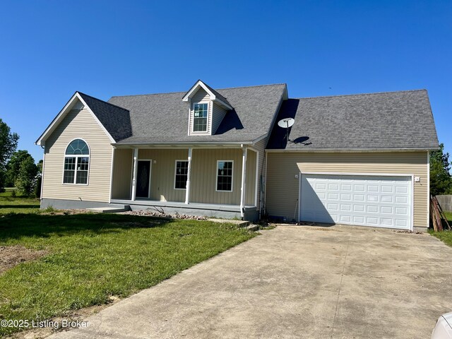 75 Labrador Way, Rineyville, KY 40162 - view of front facade with concrete driveway, a garage, a porch, a front lawn, and board and batten siding