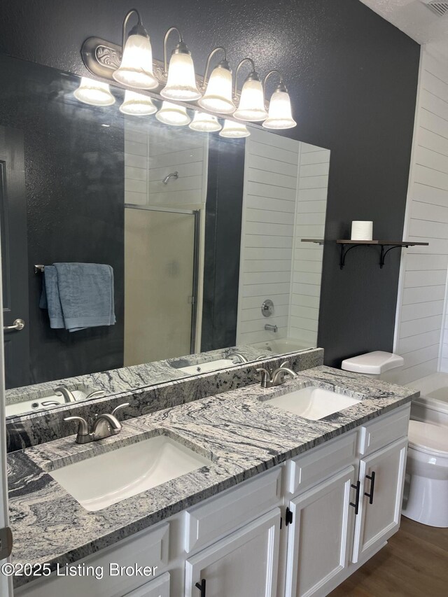 75 Labrador Way, Rineyville, KY 40162 - bathroom with toilet, a shower, wood finished floors, double vanity, and a bathtub
