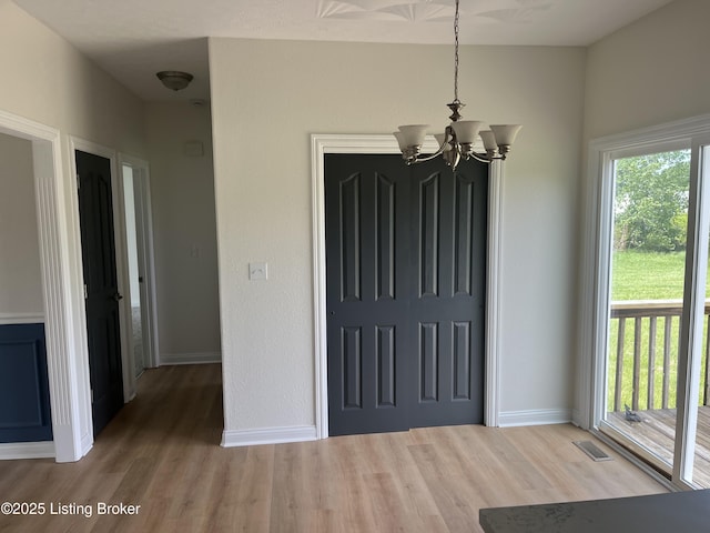 75 Labrador Way, Rineyville, KY 40162 - entryway with wood finished floors, baseboards, and a chandelier