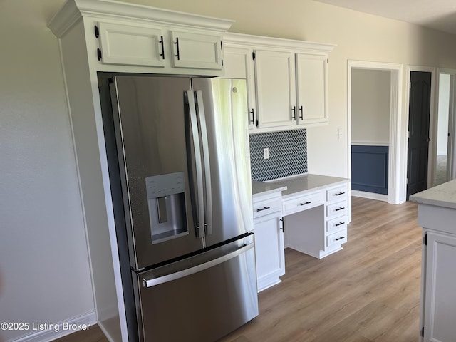 75 Labrador Way, Rineyville, KY 40162 - kitchen with stainless steel fridge with ice dispenser, backsplash, light wood finished floors, and white cabinets