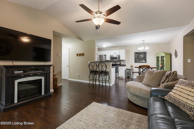 10207 Deer Vista Dr Unit 204, Louisville, KY 40291 - living room with a ceiling fan, dark wood-style floors, vaulted ceiling, baseboards, and a chandelier