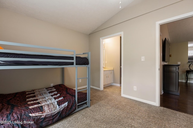 10207 Deer Vista Dr Unit 204, Louisville, KY 40291 - unfurnished bedroom with vaulted ceiling, carpet, baseboards, and connected bathroom