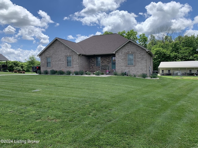 107 Clymene Rd, Cecilia, KY 42724 - view of front of home featuring brick siding and a front lawn