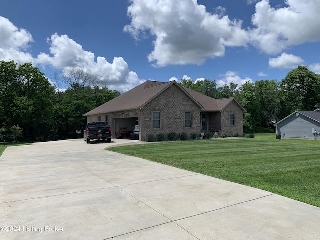 107 Clymene Rd, Cecilia, KY 42724 - ranch-style home featuring brick siding, a front yard, an attached garage, and concrete driveway