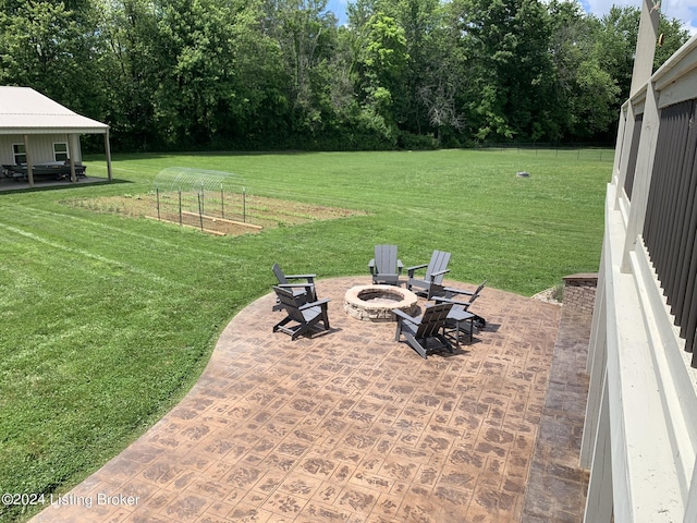 107 Clymene Rd, Cecilia, KY 42724 - view of green lawn featuring an outdoor fire pit and a patio area