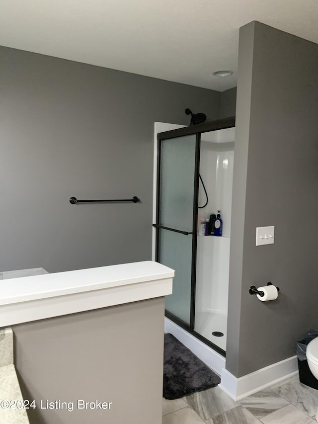 107 Clymene Rd, Cecilia, KY 42724 - full bathroom featuring a shower stall, baseboards, and toilet