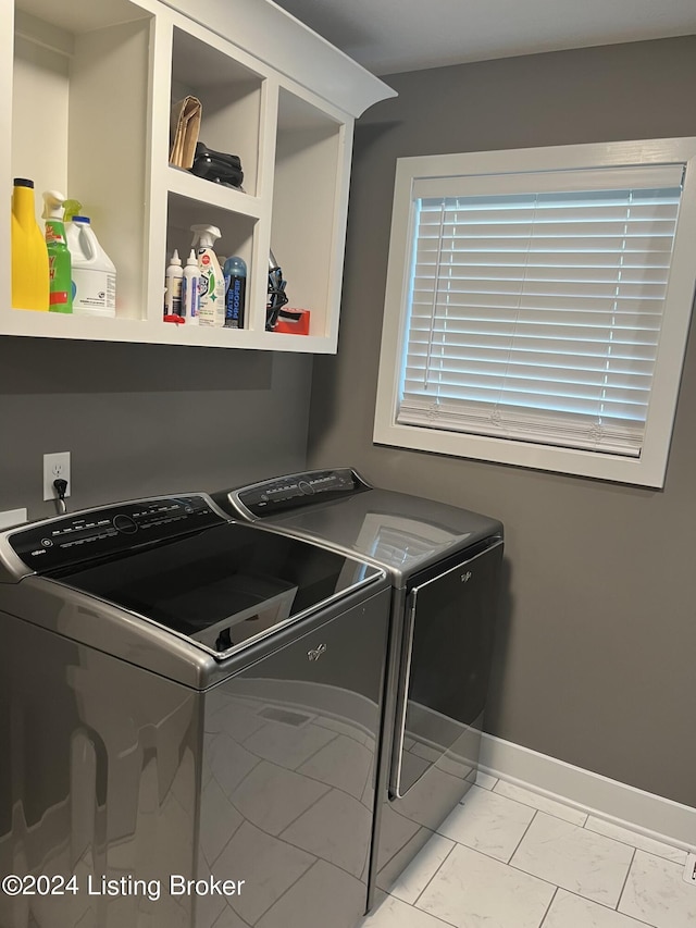 107 Clymene Rd, Cecilia, KY 42724 - laundry room featuring washing machine and dryer and baseboards