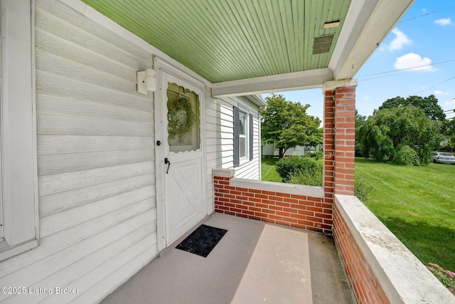 4309 Cavelle Ave, Louisville, KY 40213 - view of exterior entry featuring a yard and covered porch