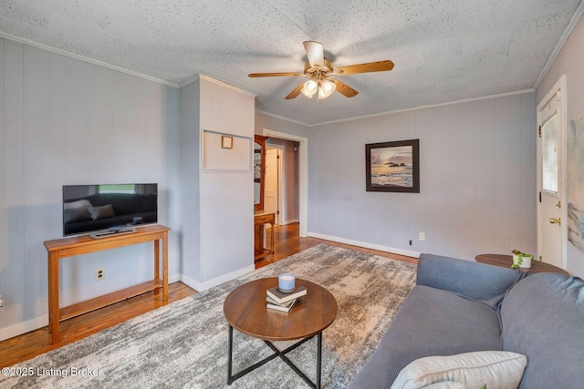 4309 Cavelle Ave, Louisville, KY 40213 - living area with wood finished floors, ceiling fan, crown molding, and baseboards
