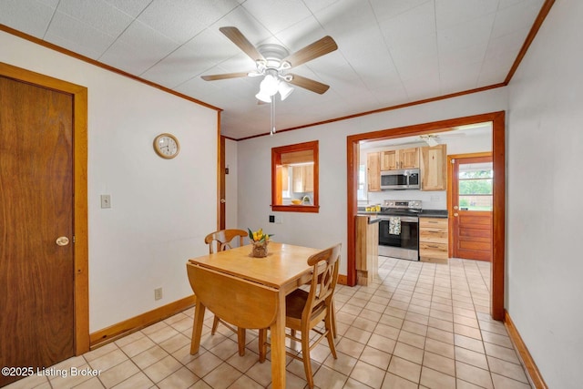 4309 Cavelle Ave, Louisville, KY 40213 - dining room featuring ornamental molding, baseboards, ceiling fan, and light tile patterned flooring