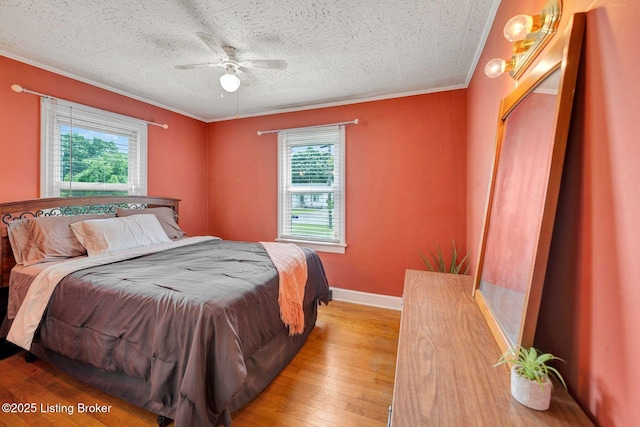 4309 Cavelle Ave, Louisville, KY 40213 - bedroom featuring multiple windows, wood-type flooring, crown molding, baseboards, and ceiling fan