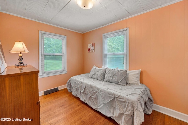 4309 Cavelle Ave, Louisville, KY 40213 - bedroom with crown molding, light wood finished floors, and baseboards