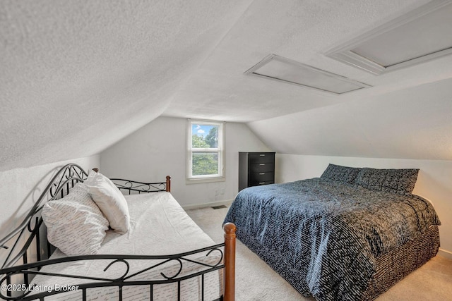 4309 Cavelle Ave, Louisville, KY 40213 - carpeted bedroom with a textured ceiling, vaulted ceiling, and baseboards