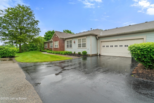 5106 Telford Ln, Louisville, KY 40241 - ranch-style home featuring asphalt driveway, an attached garage, a front yard, and brick siding