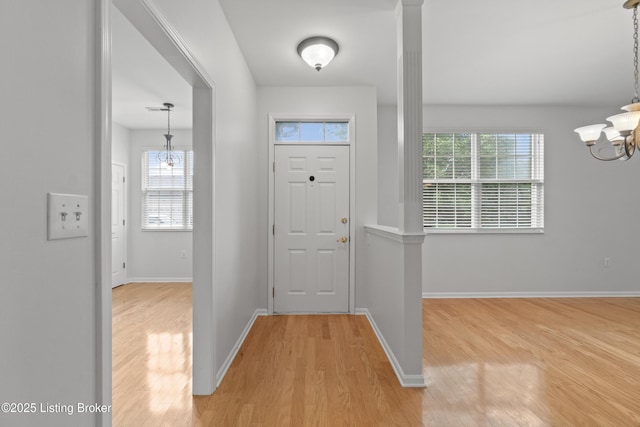 5106 Telford Ln, Louisville, KY 40241 - entrance foyer featuring a chandelier, wood finished floors, and plenty of natural light