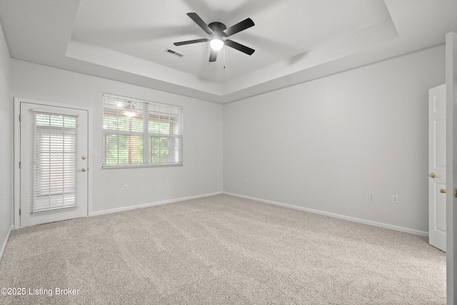 5106 Telford Ln, Louisville, KY 40241 - carpeted spare room featuring a tray ceiling, ceiling fan, and baseboards