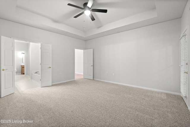 5106 Telford Ln, Louisville, KY 40241 - unfurnished bedroom featuring a tray ceiling, light colored carpet, baseboards, and a ceiling fan