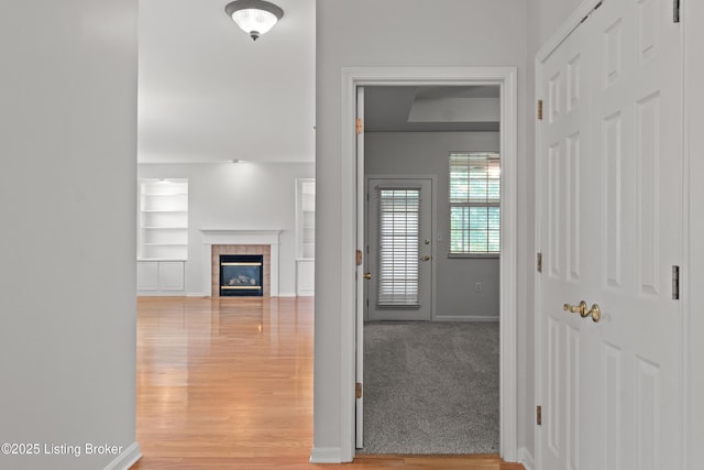 5106 Telford Ln, Louisville, KY 40241 - corridor featuring light wood-style flooring, baseboards, and built in shelves
