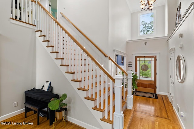 13318 Stepping Stone Way, Louisville, KY 40299 - foyer with stairway, wood finished floors, a chandelier, baseboards, and a high ceiling