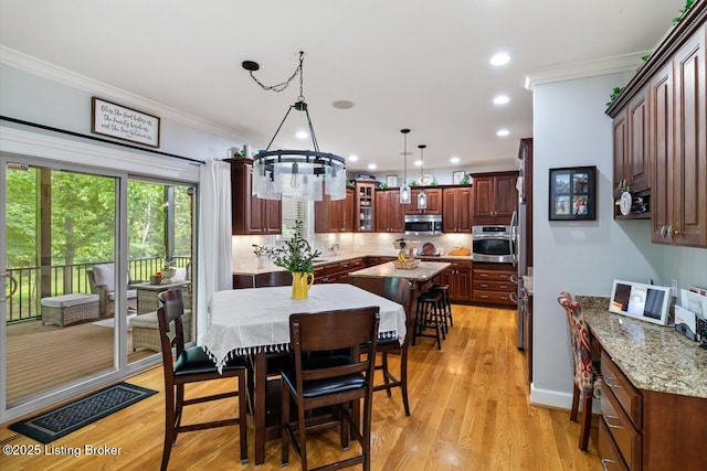 13318 Stepping Stone Way, Louisville, KY 40299 - dining space with crown molding, light wood finished floors, a chandelier, and recessed lighting