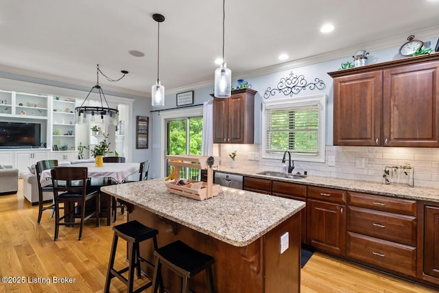 13318 Stepping Stone Way, Louisville, KY 40299 - kitchen with a sink, stainless steel dishwasher, crown molding, a center island, and decorative backsplash