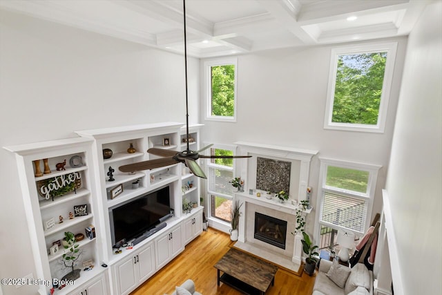 13318 Stepping Stone Way, Louisville, KY 40299 - living room featuring beamed ceiling, a tile fireplace, light wood-style floors, ornamental molding, and coffered ceiling