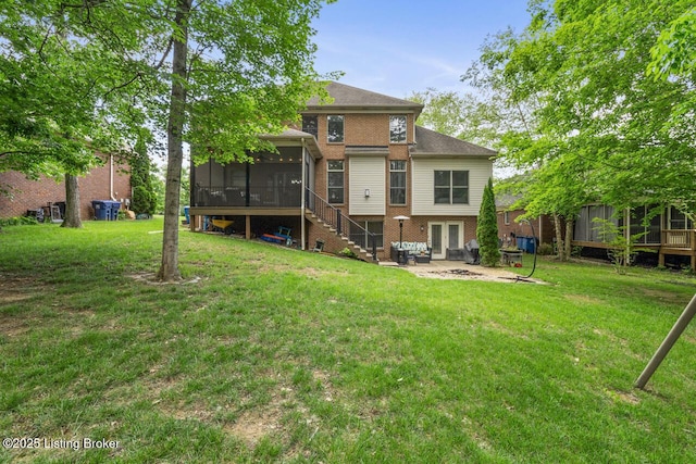 13318 Stepping Stone Way, Louisville, KY 40299 - back of property with a sunroom, a lawn, brick siding, a patio area, and stairway