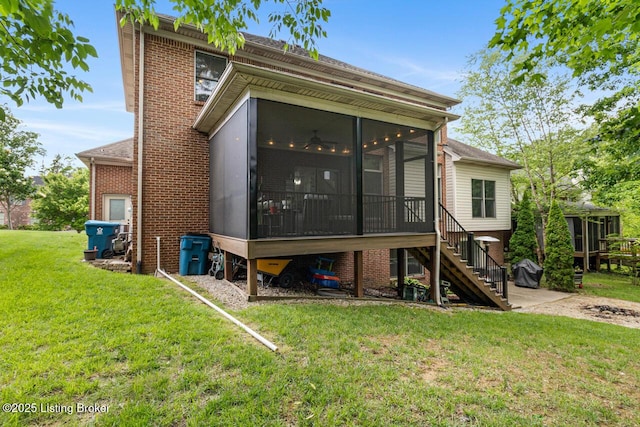 13318 Stepping Stone Way, Louisville, KY 40299 - rear view of house featuring a sunroom, a lawn, stairway, and brick siding