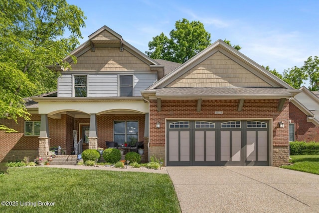 13318 Stepping Stone Way, Louisville, KY 40299 - view of front of home with a porch, driveway, a garage, and a front lawn