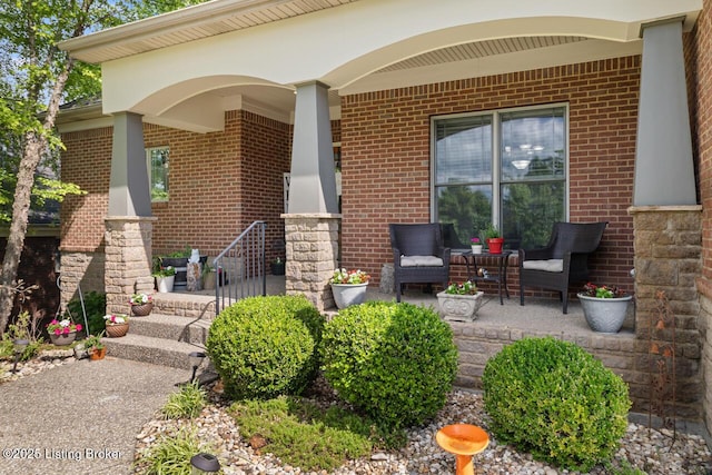 13318 Stepping Stone Way, Louisville, KY 40299 - property entrance featuring brick siding, a porch, and outdoor lounge area