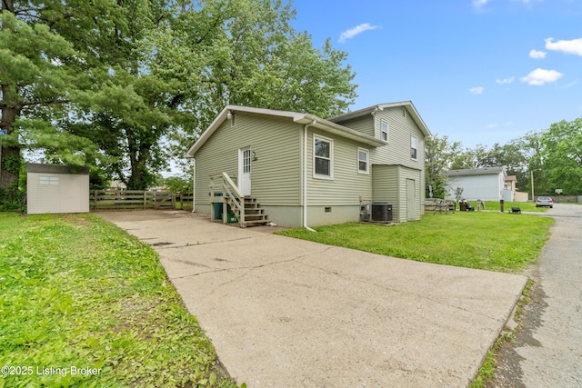 3802 Breckenridge Ln, Louisville, KY 40218 - view of side of home featuring central air condition unit, concrete driveway, and crawl space
