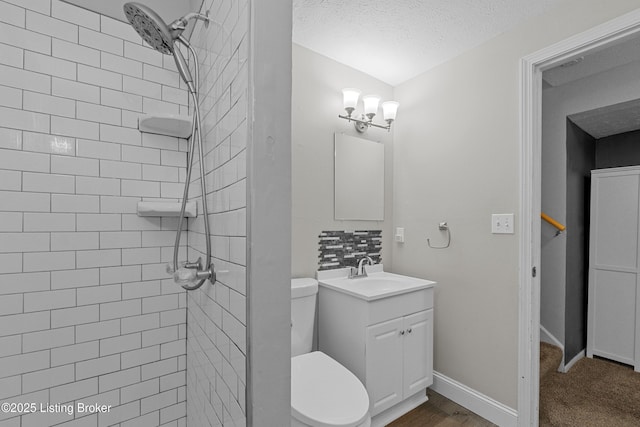 3802 Breckenridge Ln, Louisville, KY 40218 - bathroom with tiled shower, vanity, toilet, and baseboards