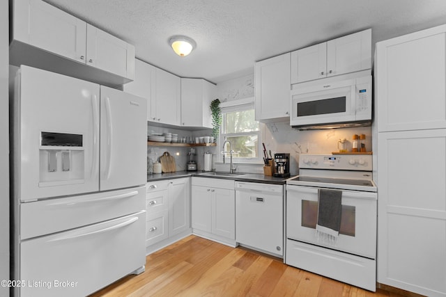3802 Breckenridge Ln, Louisville, KY 40218 - kitchen with white appliances, a sink, open shelves, dark countertops, and white cabinetry