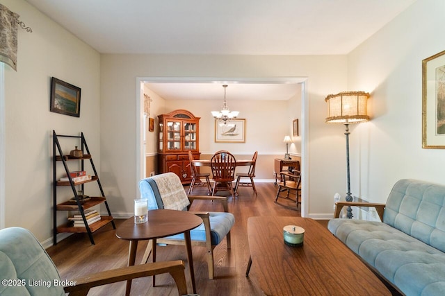 12115 Alpine Way, Goshen, KY 40026 - living room with wood finished floors, a chandelier, and baseboards