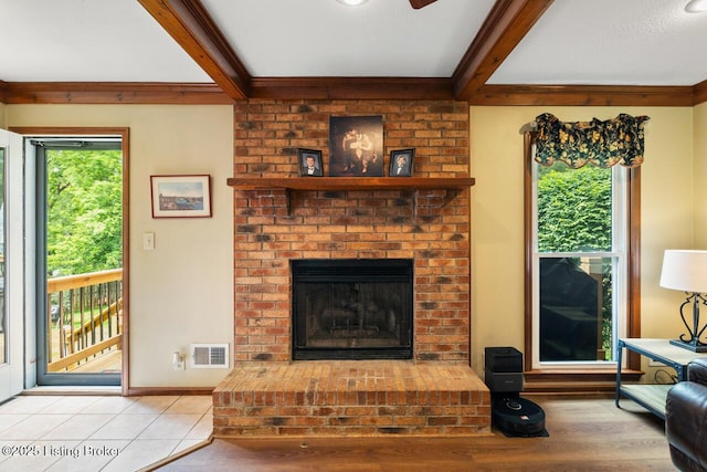 12115 Alpine Way, Goshen, KY 40026 - living room featuring beamed ceiling, a fireplace, wood finished floors, and a ceiling fan