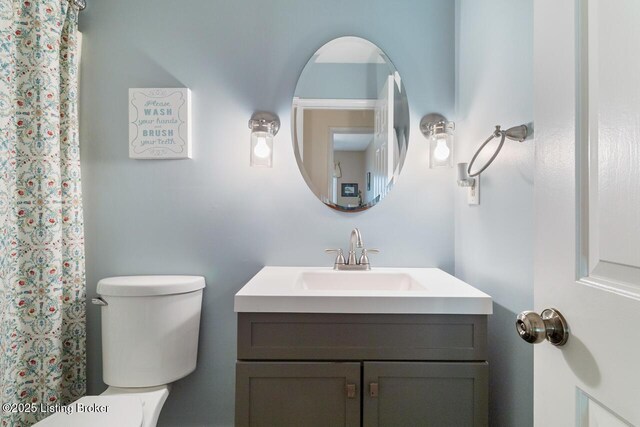 12115 Alpine Way, Goshen, KY 40026 - bathroom featuring vanity, toilet, and curtained shower
